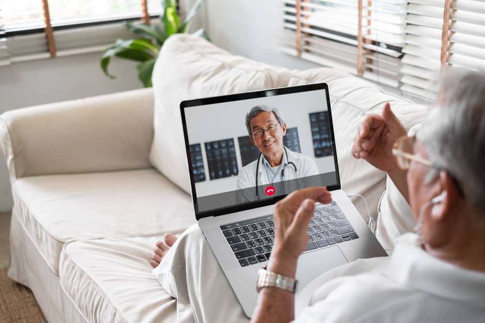 Male patient speaking to doctor on video call